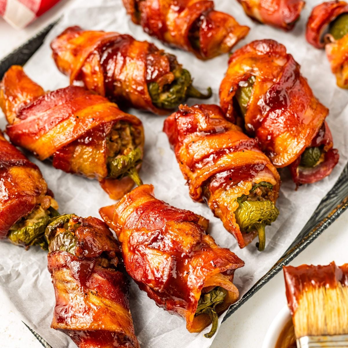 Texas Twinkies o a baking sheet with a bbq brush sitting on the side