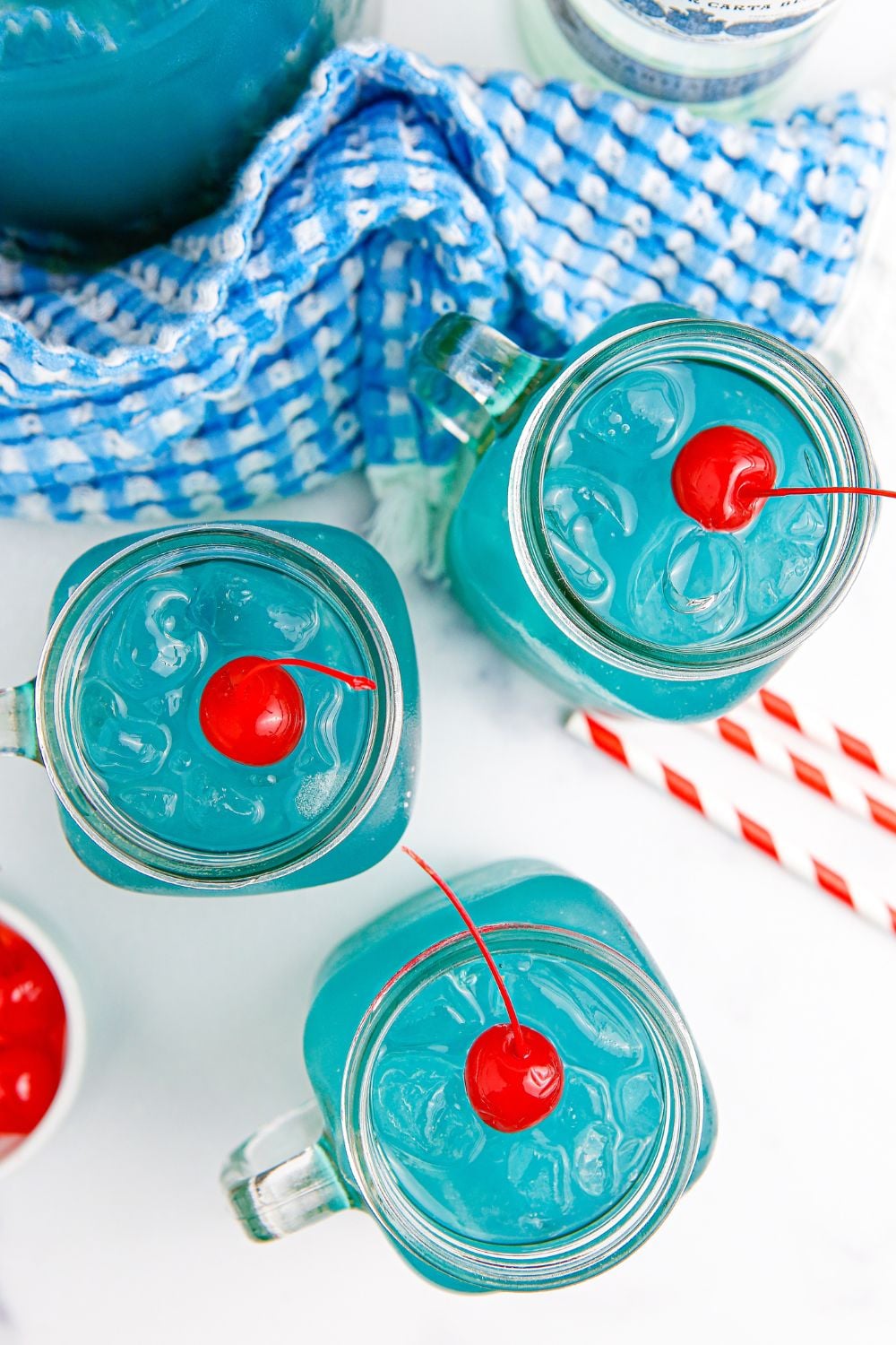Blue Hawaiian Punch in glasses sitting on table