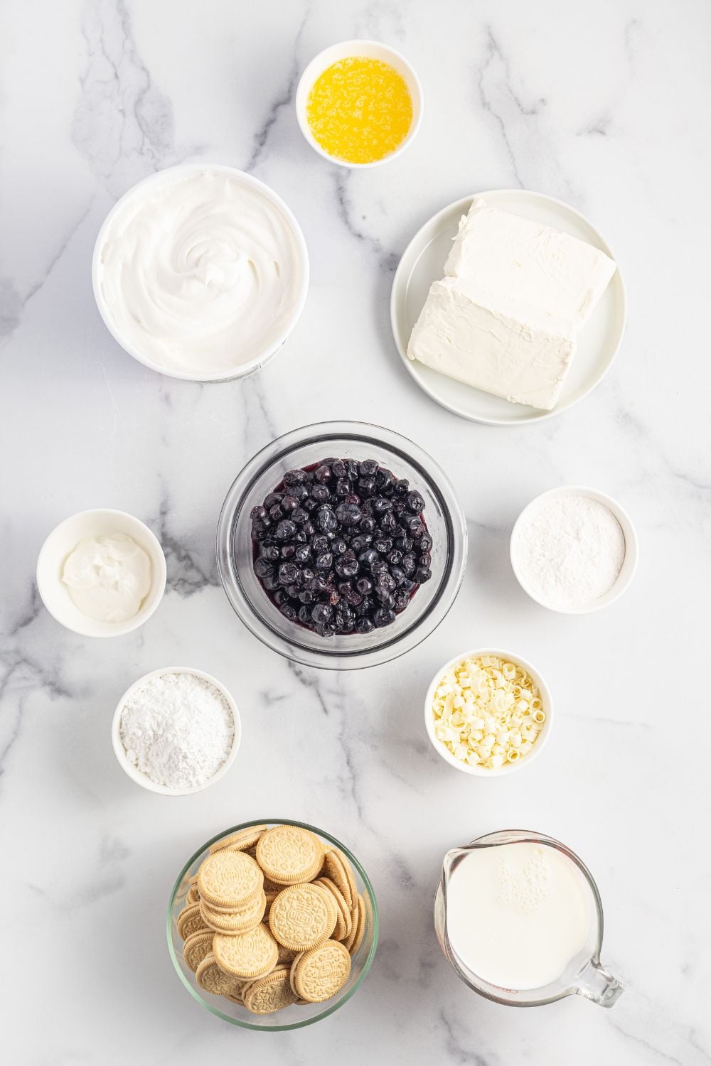 ingredients for Lemon Blueberry Lush on table in single serve glass bowls
