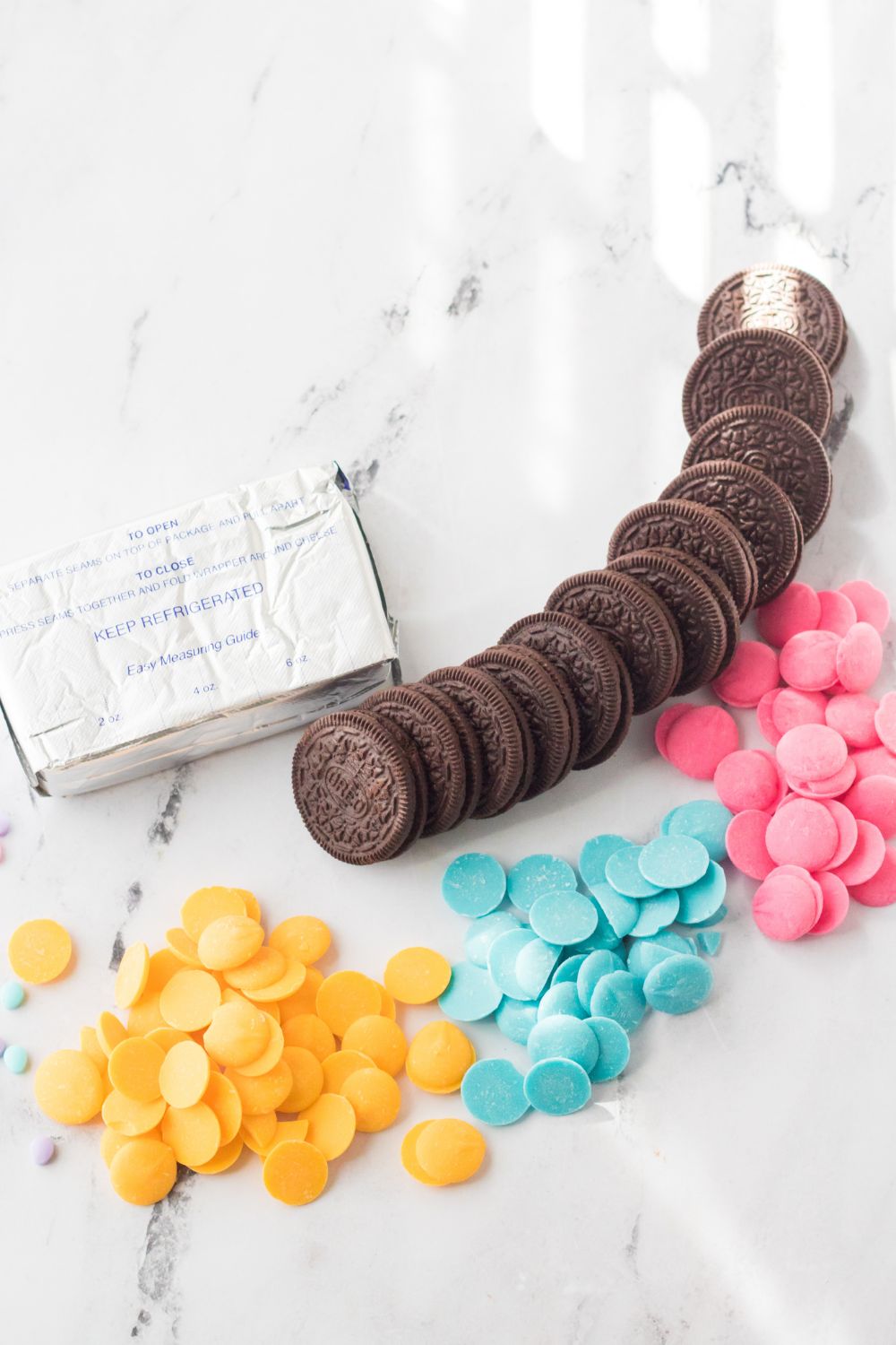 Easter Egg Oreo Truffles ingredients on a marble counter top