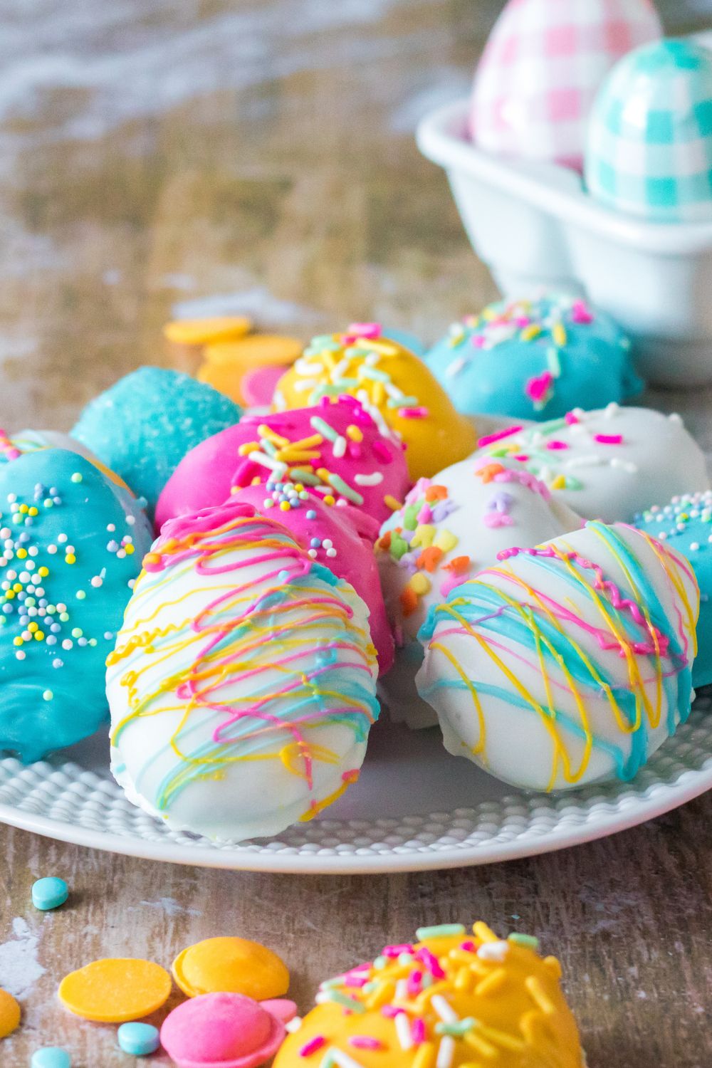 Easter Egg Oreo Truffles on a plate with a close up view of decorations