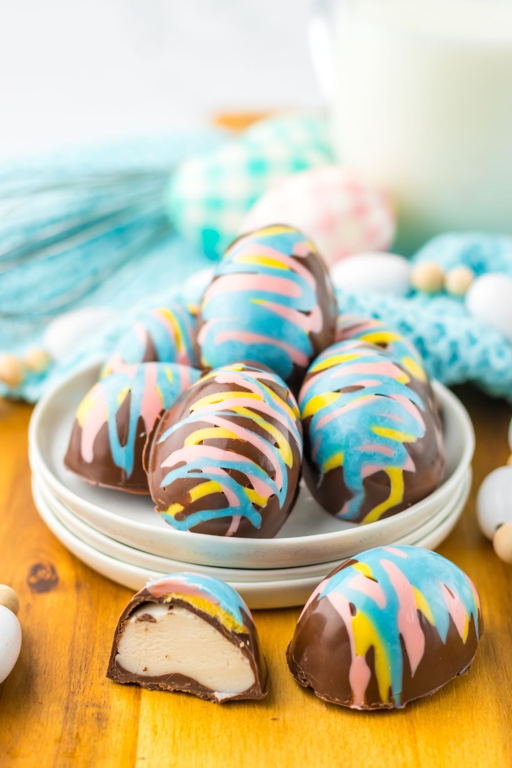 Easter Marshmallow Eggs that ar chocolate and pastel colored chocolates sitting on table in a bowl 