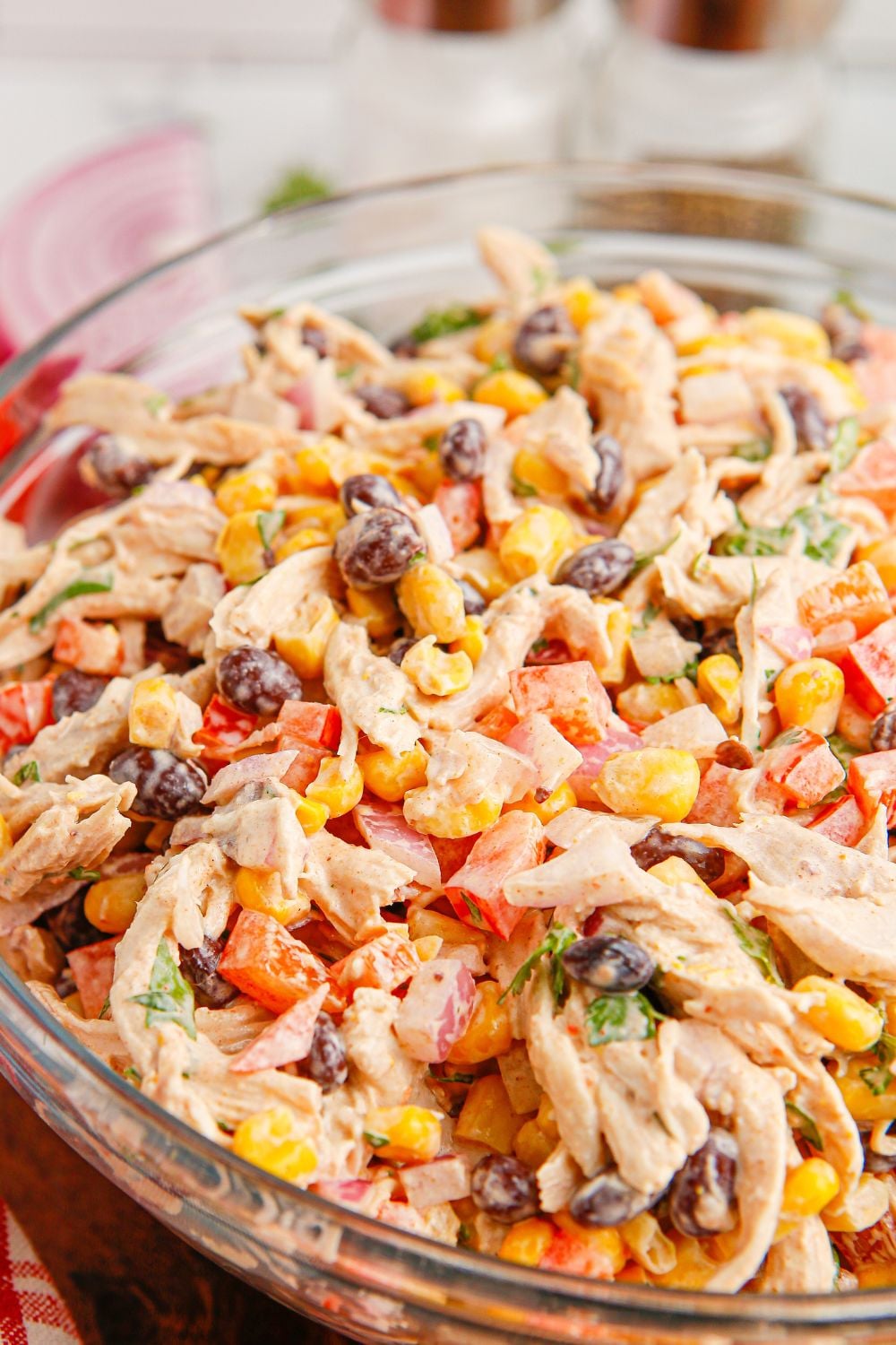 side view of Southwest Chicken Salad in a glass bowl on table