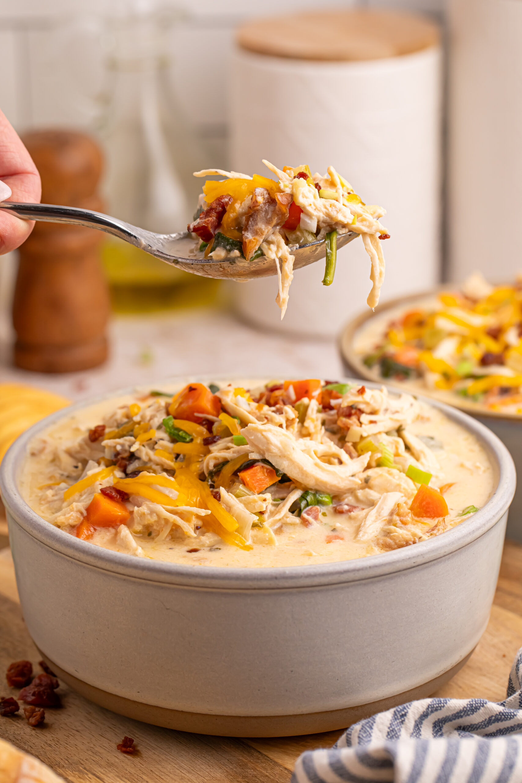 Crack Chicken Soup in a bowl with a spoon lifting up a bite