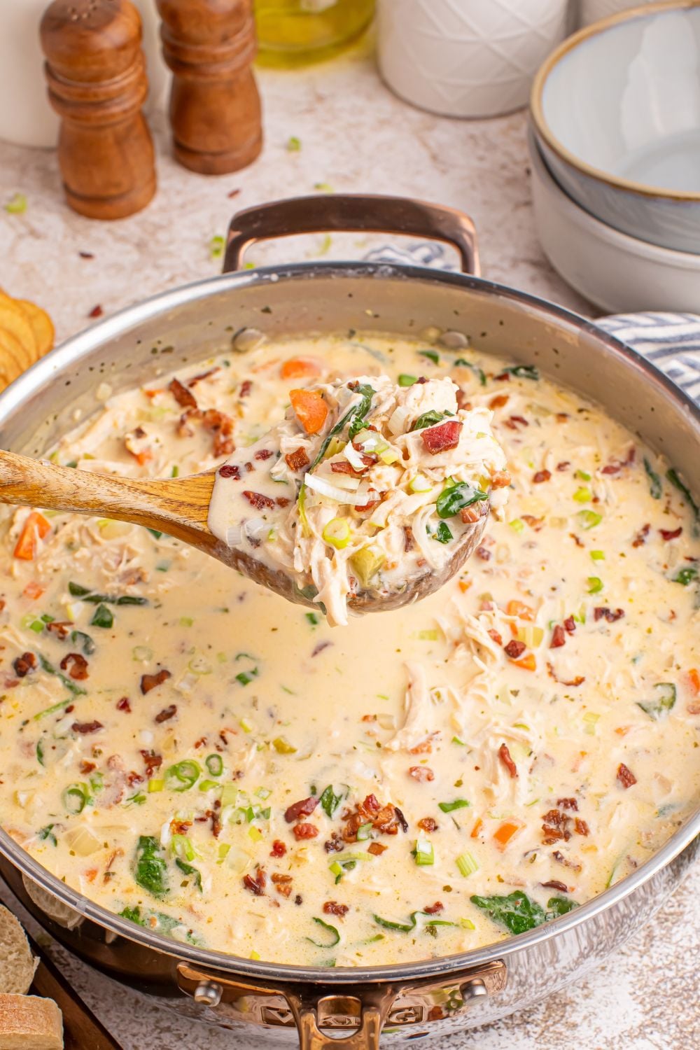Crack Chicken Soup in a pan with a ladle of soup above the pan