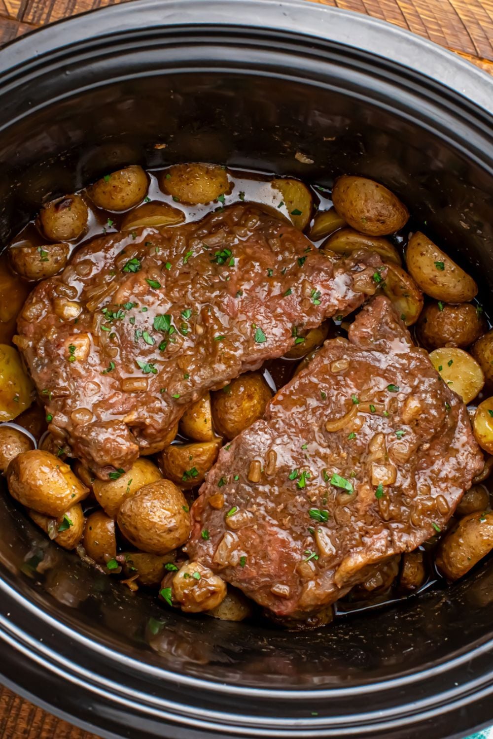 overhead look of Crock Pot Steak and Potatoes in the slow cooker