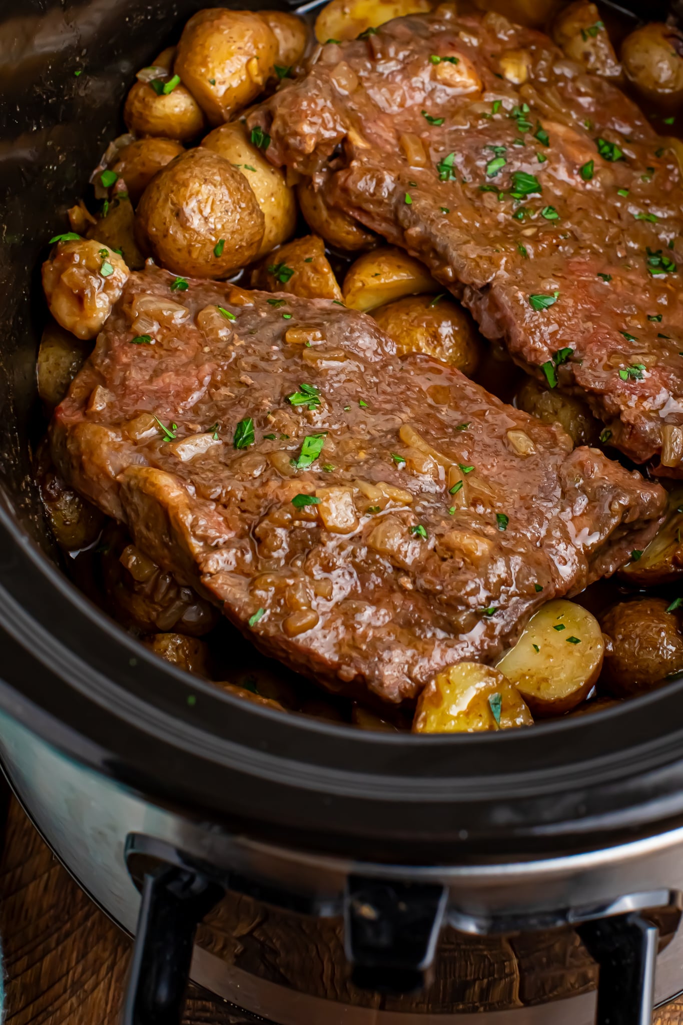 Crock Pot Steak and Potatoes in a crock pot overhead shot