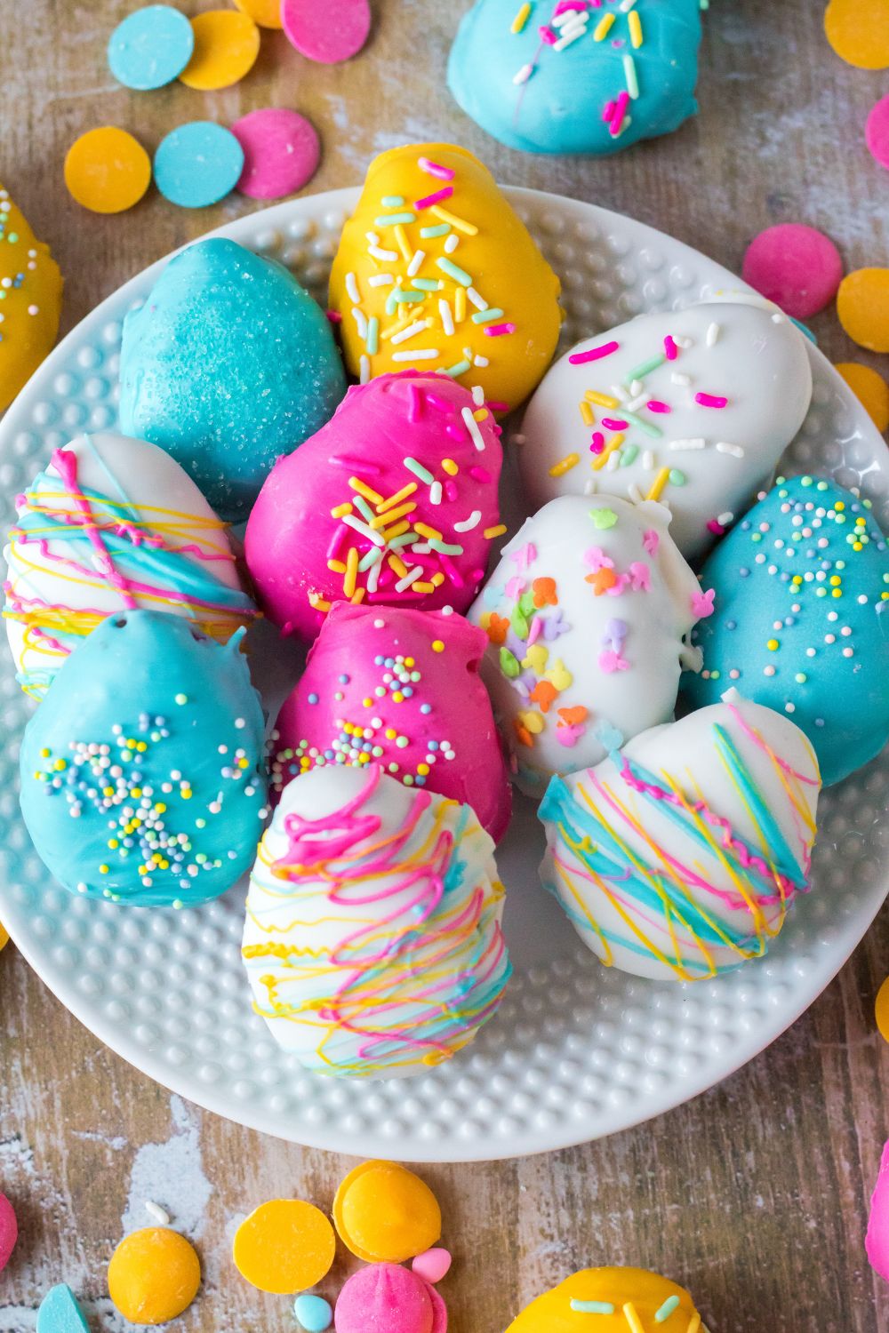 Easter Egg Oreo Truffles spread out over a plate on a table