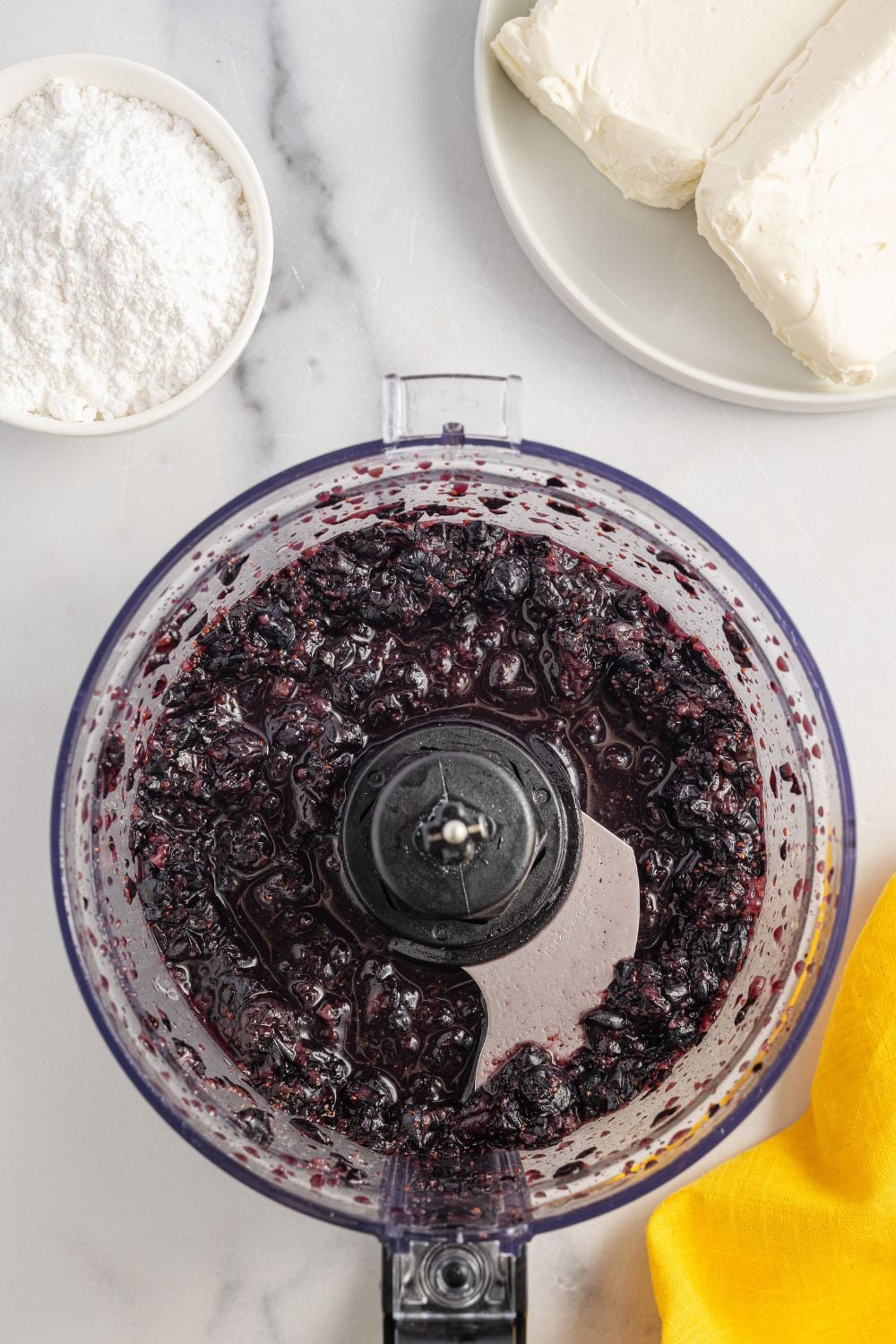 blueberries in a food processor blended up