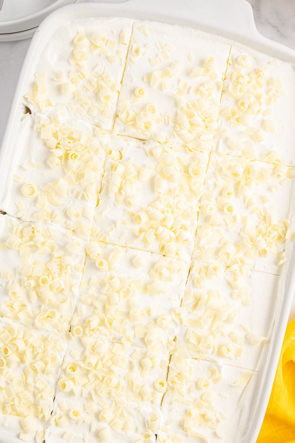 overhead look of lemon delight dessert in a casserole pan on table