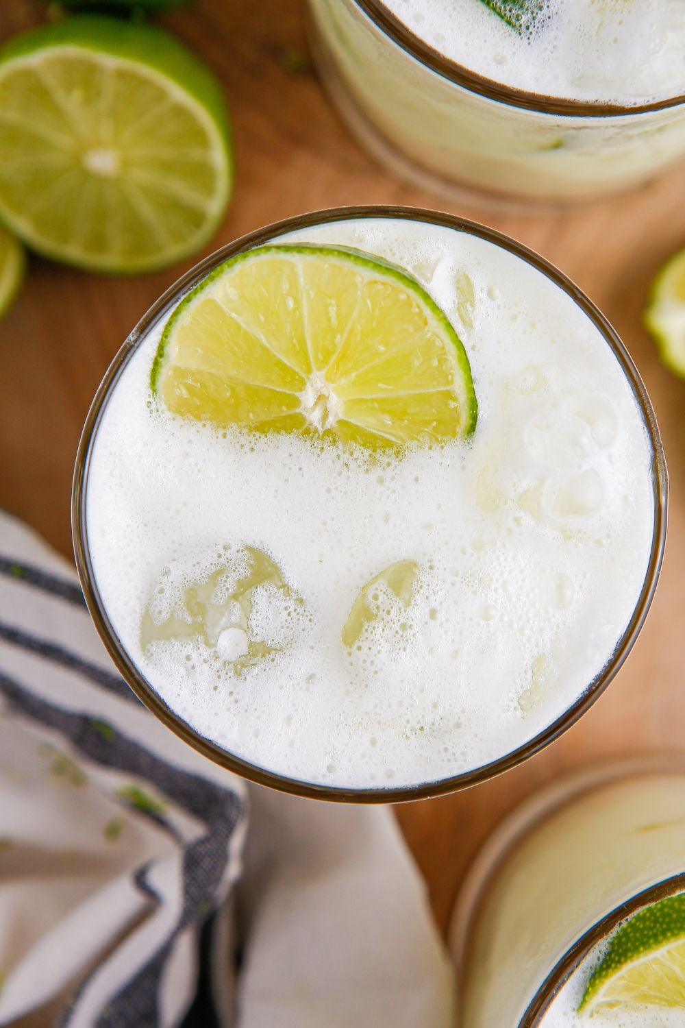 Brazilian Limeade overhead look of it in glass with a lime garnish