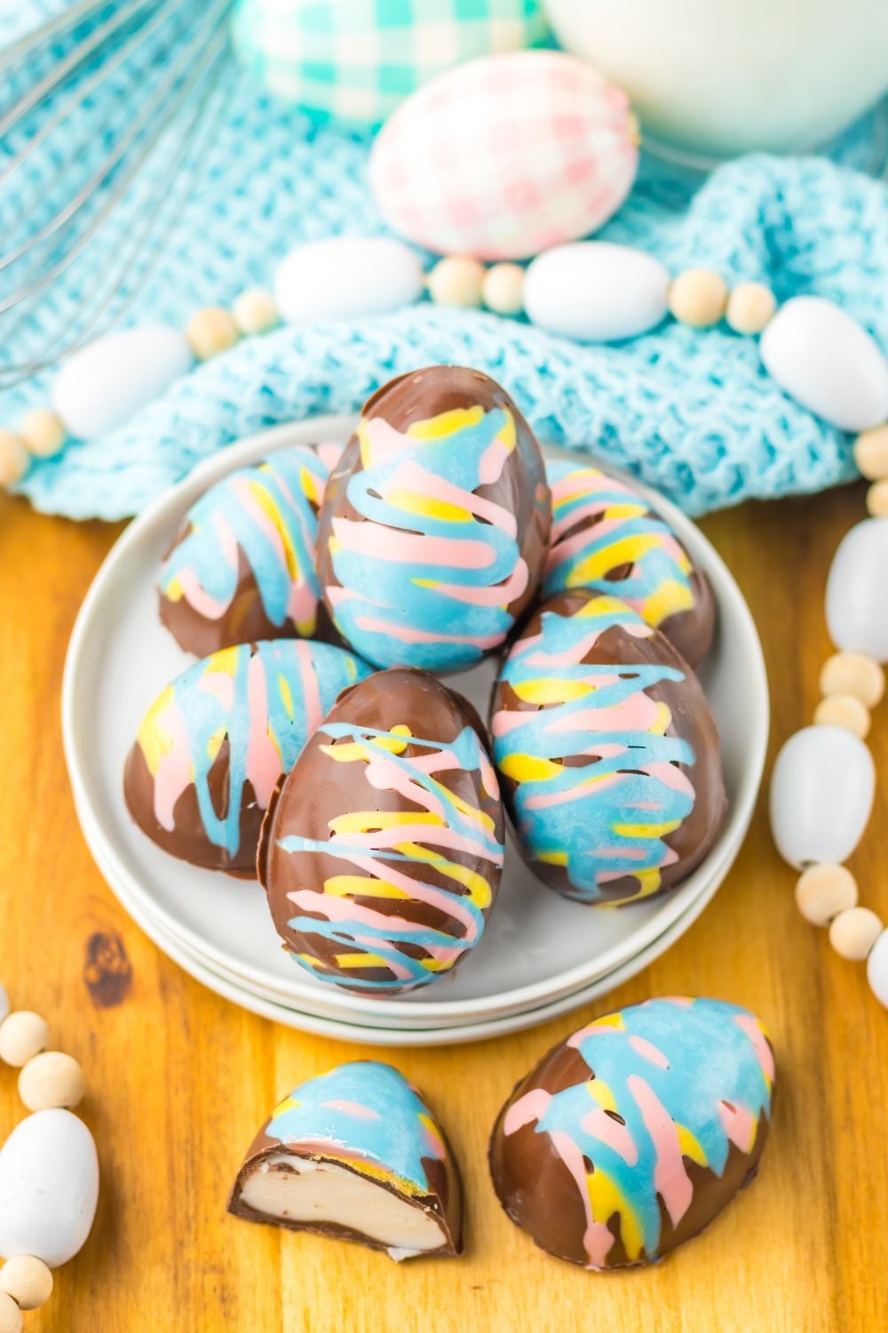 Easter Marshmallow Eggs on a plate with Easter decor around it 