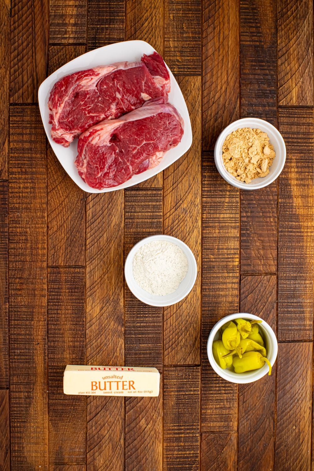 ingredients for Slow Cooker Mississippi Ribeye Steaks on the wooden table