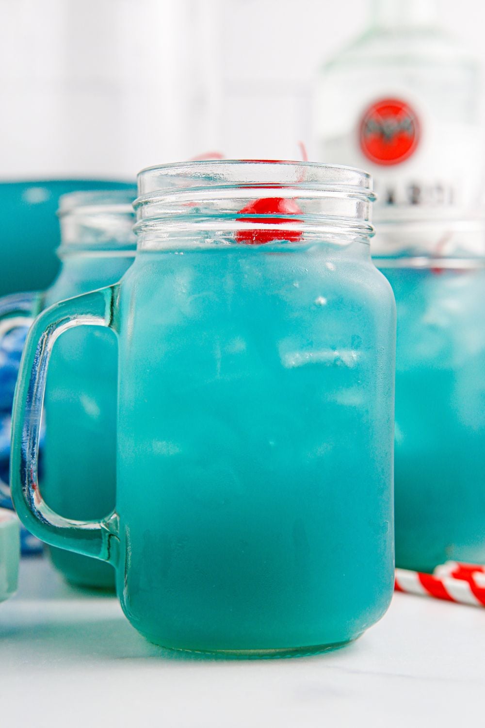 side of glass on table with Blue Hawaiian Punch in it