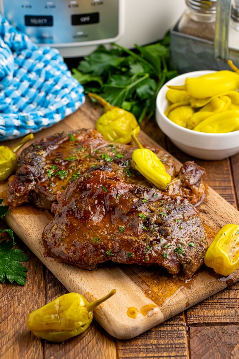 steak au jus on cutting board fromSlow Cooker Mississippi Ribeye Steaks