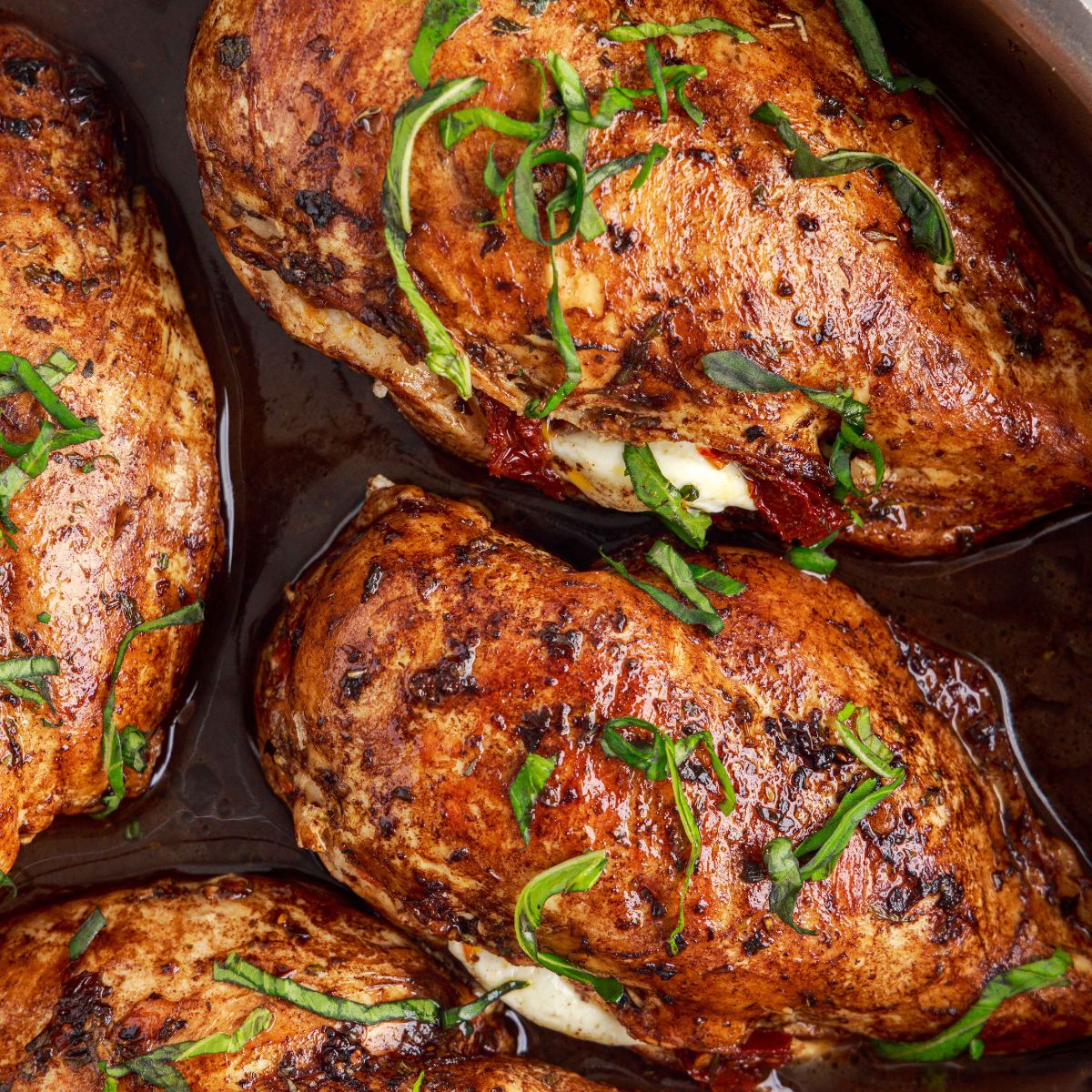 Caprese Stuffed Chicken in a skillet 