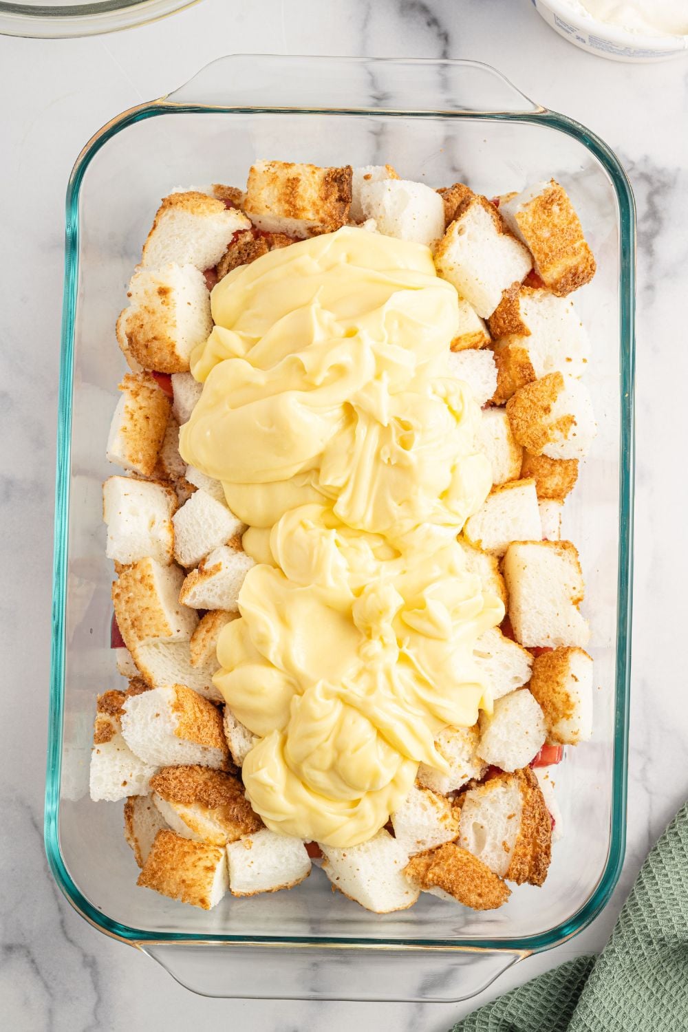 angel food cake cubes with pudding on top of it
