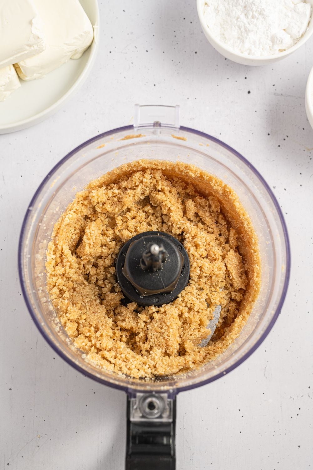 vanilla wafers crushed up in food processor on table