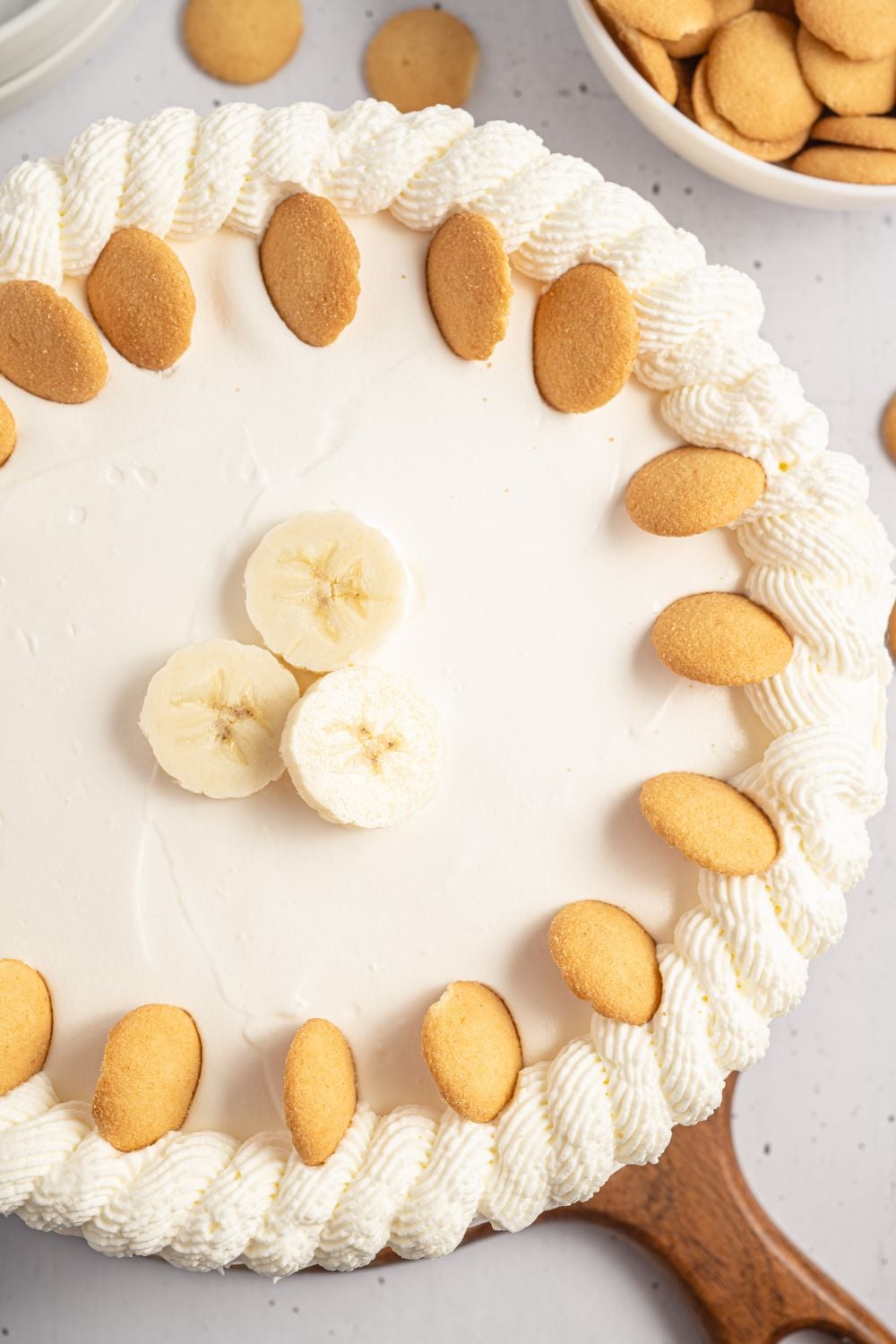 No Bake Banana Pudding Cheesecake sitting on a cutting board on table