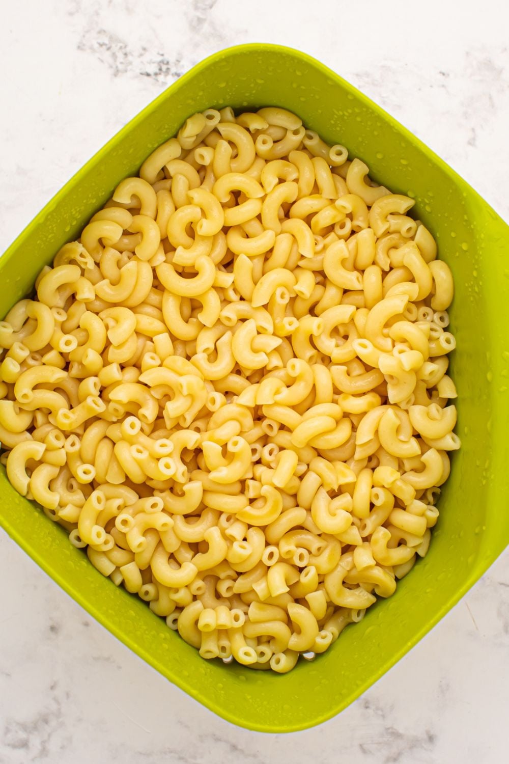 cooked macaroni in a strainer 