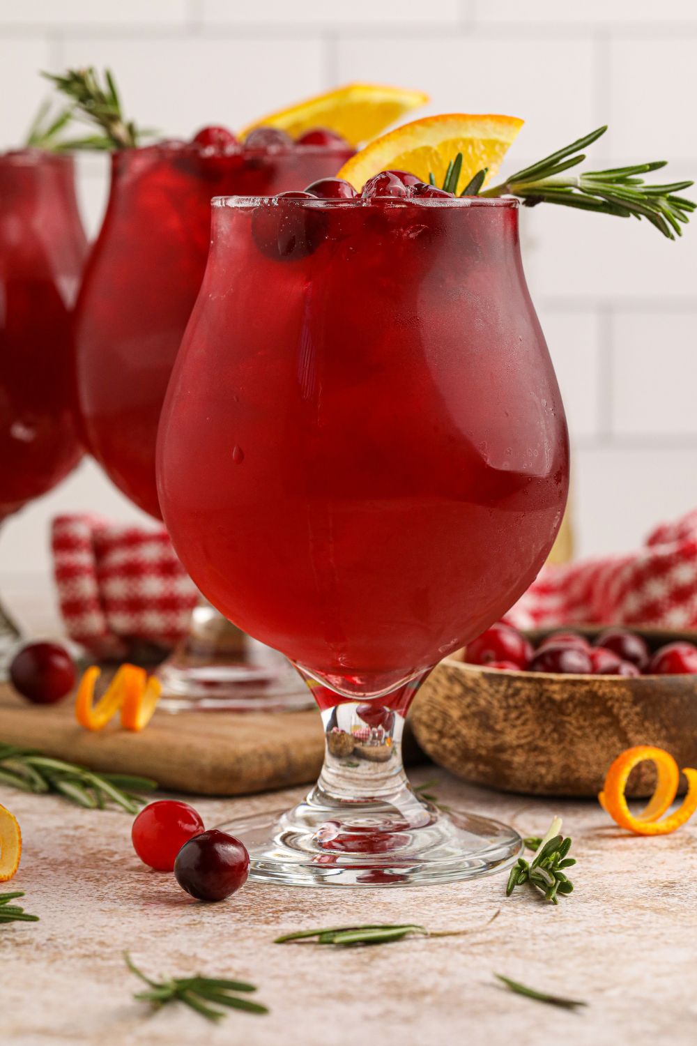 cranberry ginger whiskey sour cocktails on table in glasses on table