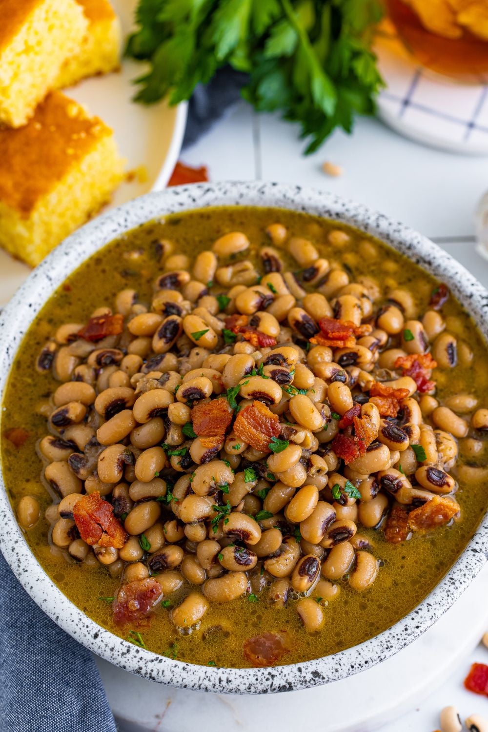 overhead look of a bowl full of bacon and black eyed peas 