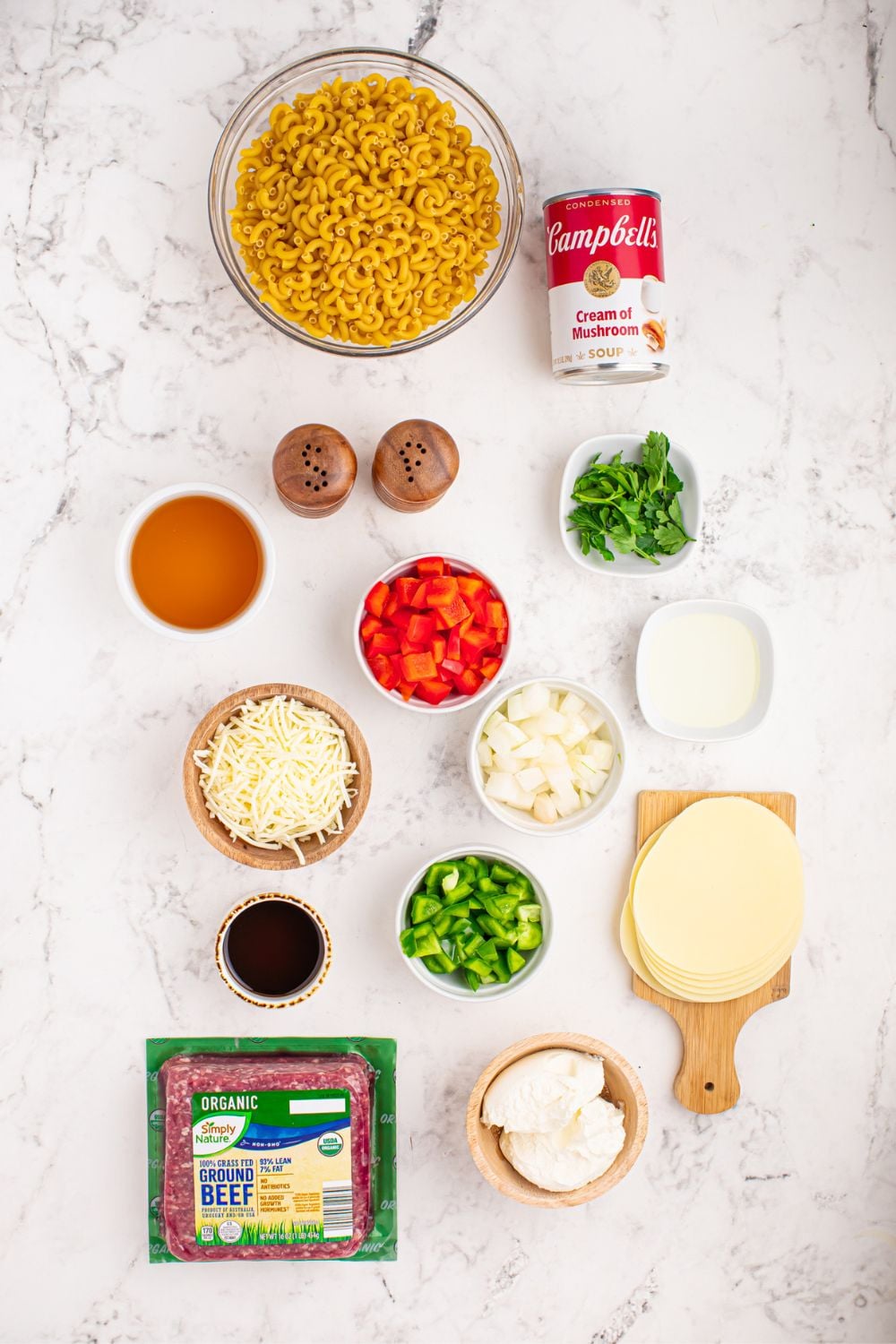 ingredients for Philly Cheesesteak Pasta on table in single serving bowls 
