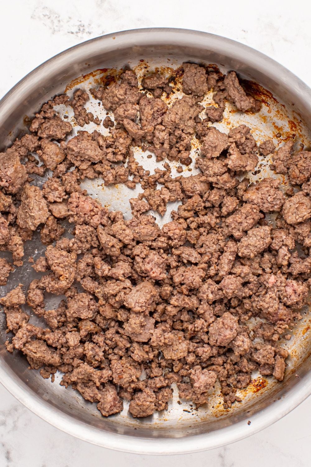 cooked ground beef in a skillet 