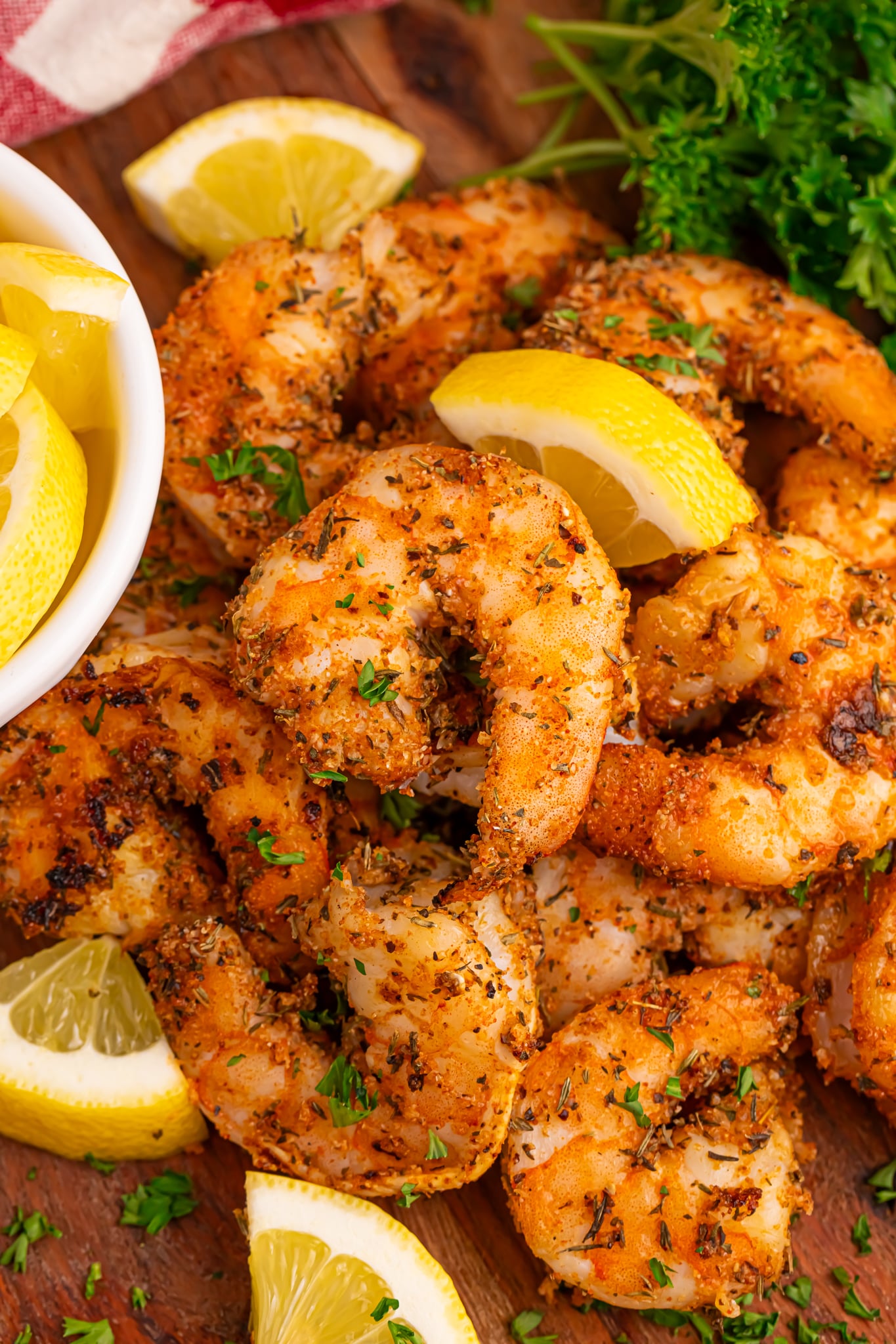 cajun shrimp piled with sliced lemons