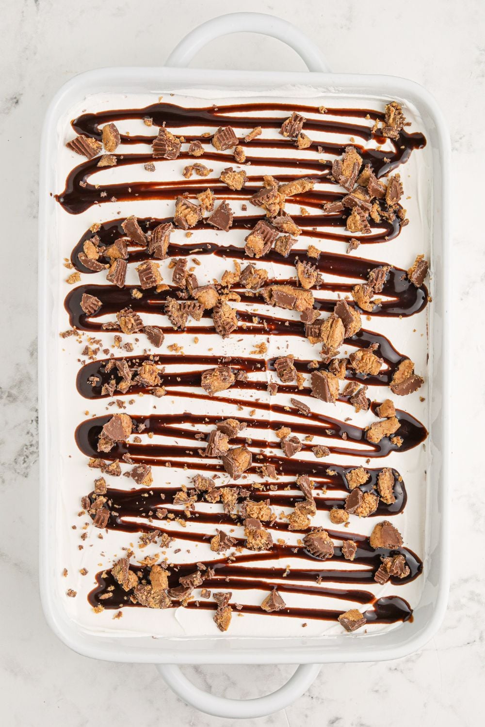 assembled Reeses Lasagna in a pan on table