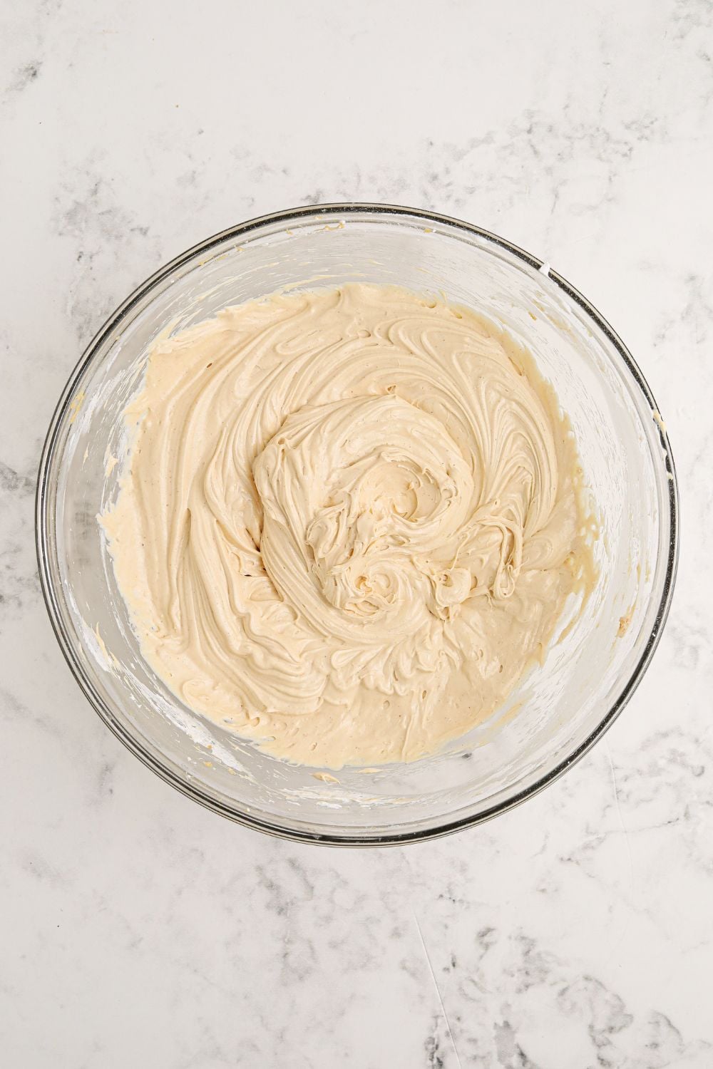 cream cheese and peanut butter mixed in a glass bowl for Reeses Lasagna