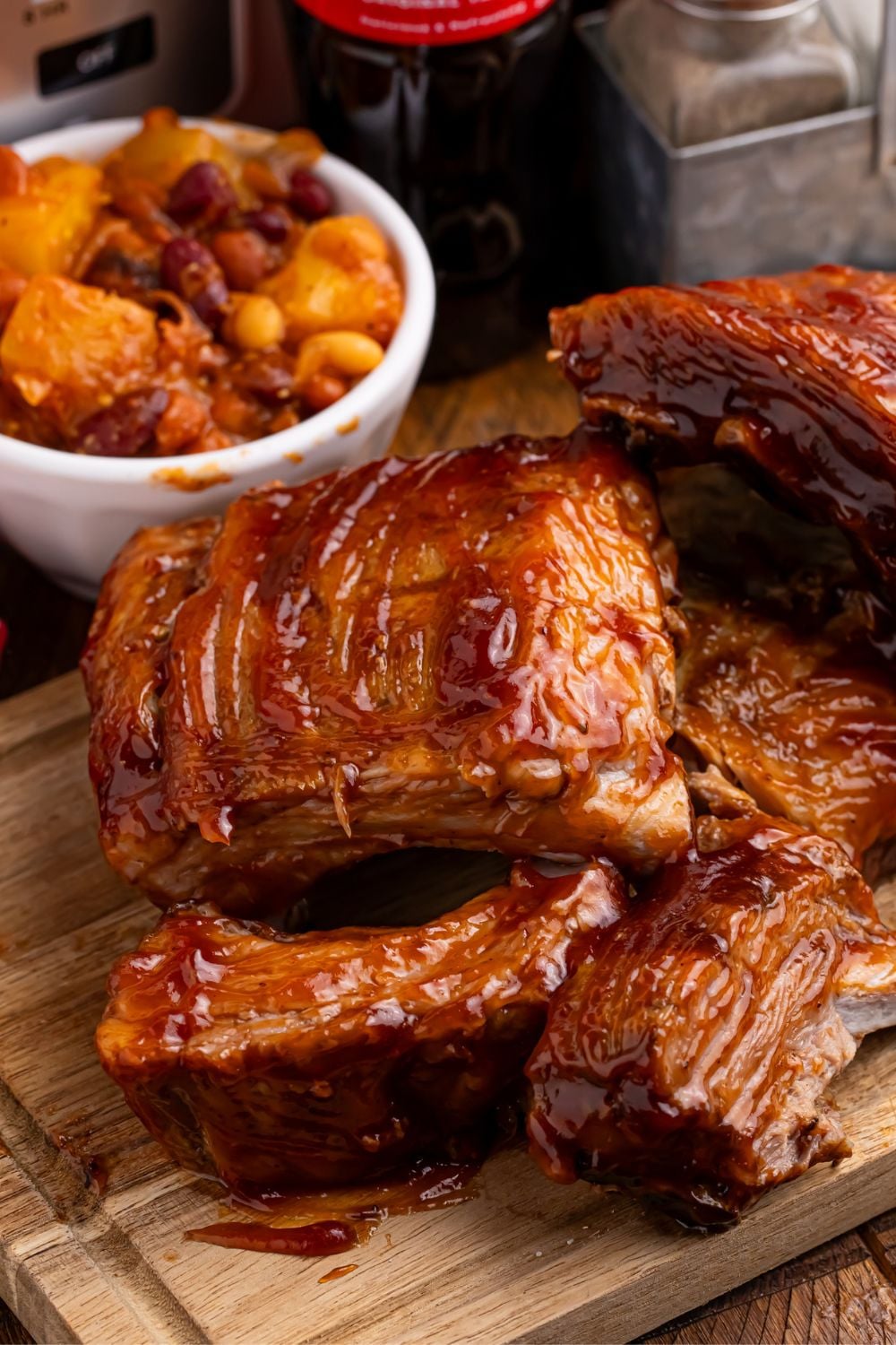 Slow Cooker Coca Cola Ribs cooked and placed on a cutting board on a table 