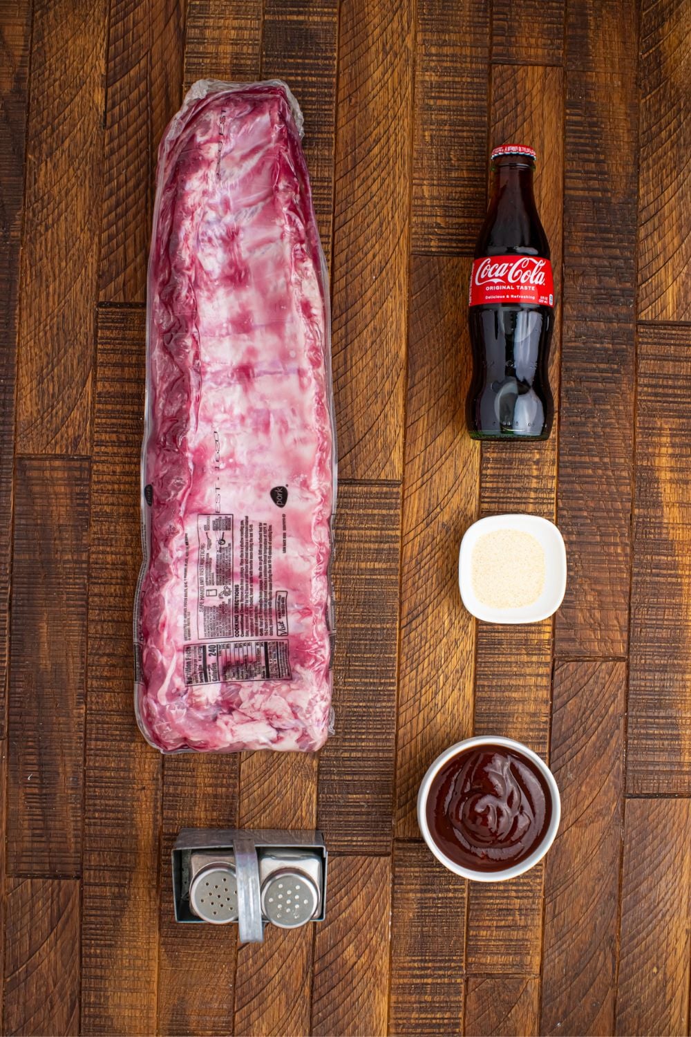 ingredients for Slow Cooker Coca Cola Ribs on wooden table. 