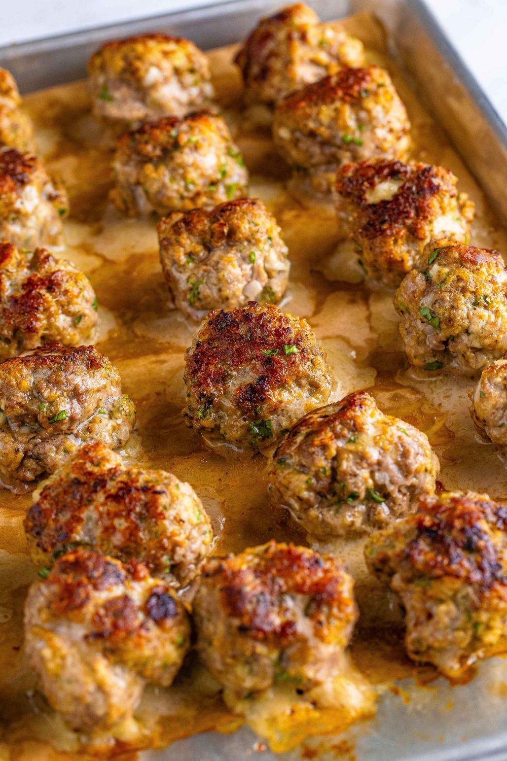cooked Classic Italian Meatballs on a baking tray after being baked in oven 