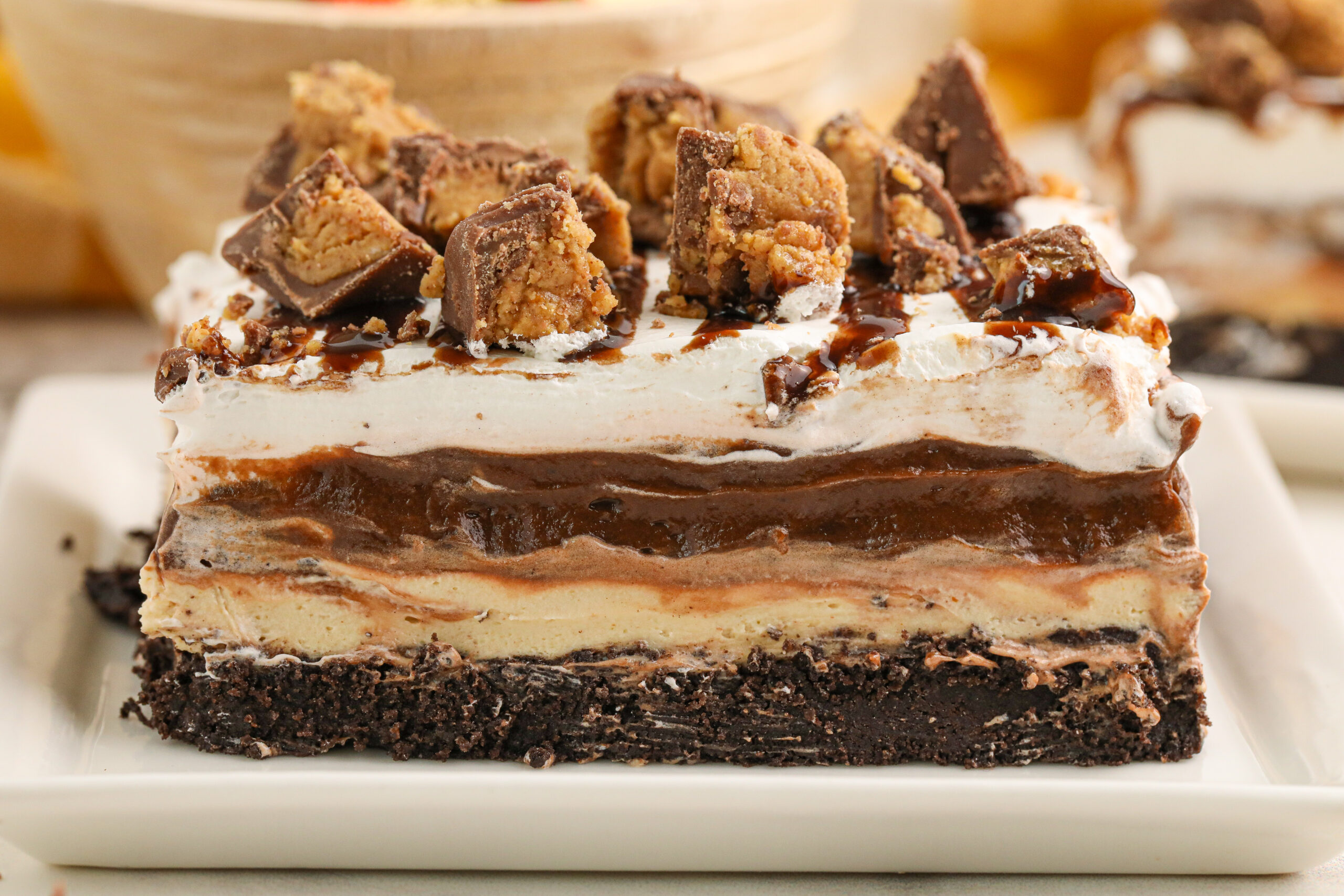 slice of reeses lasagna on a white plate up close