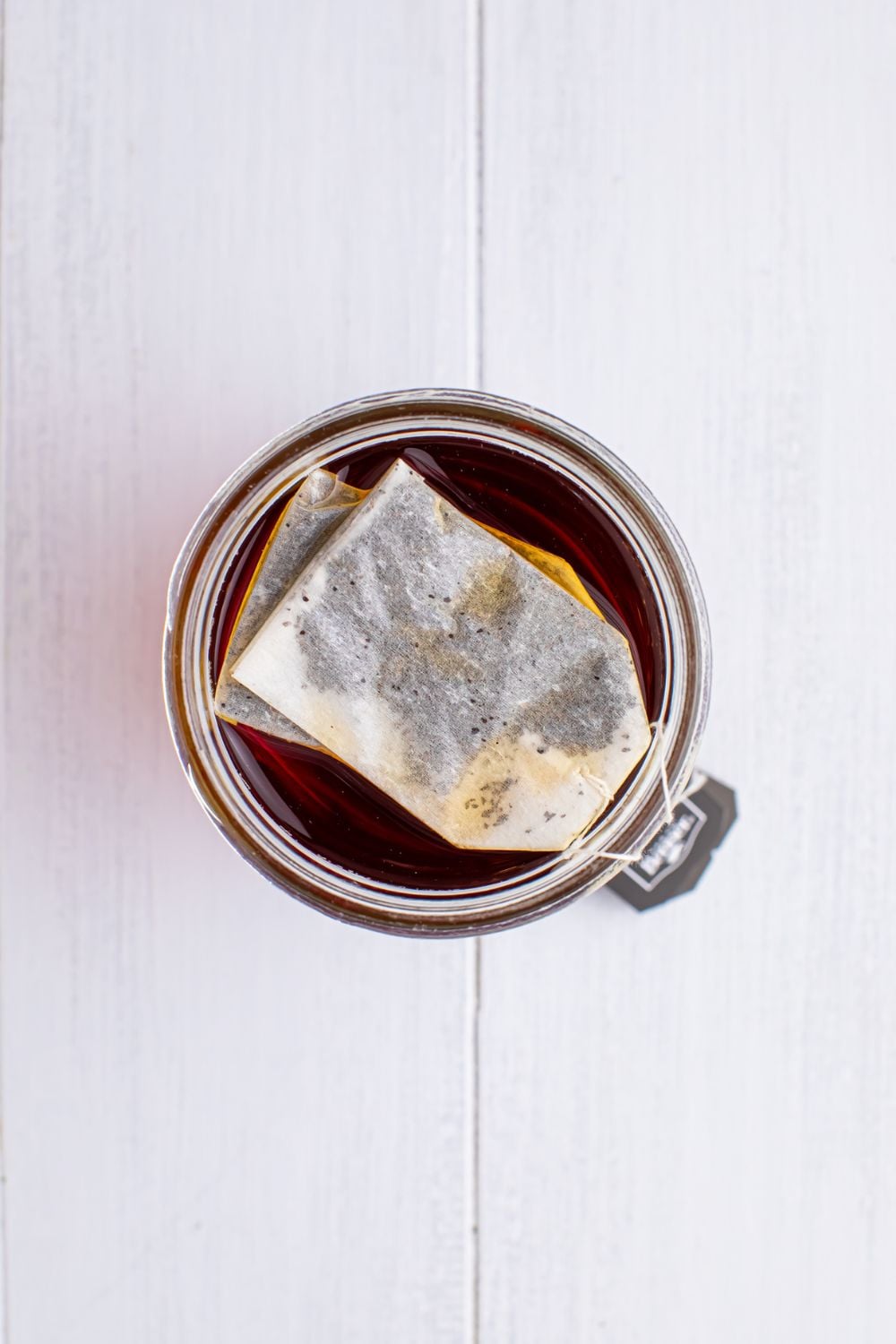 tea bag in a glass on table