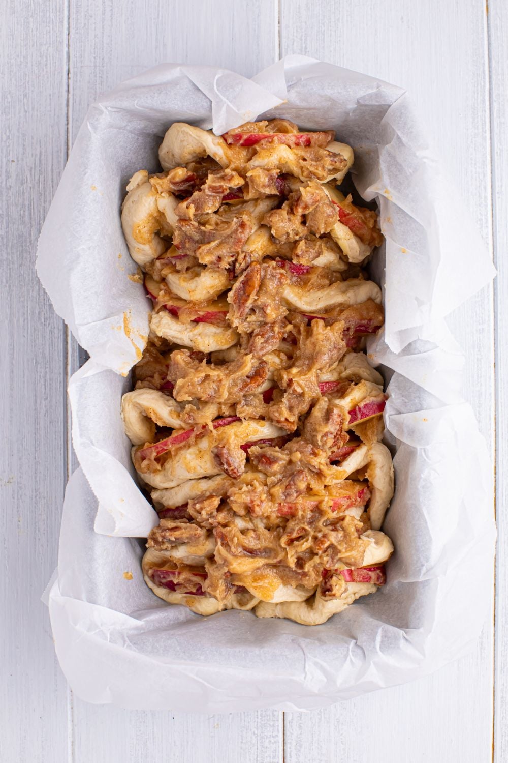 raw Apple Pie Pull Apart Bread in a loaf pan sitting on table