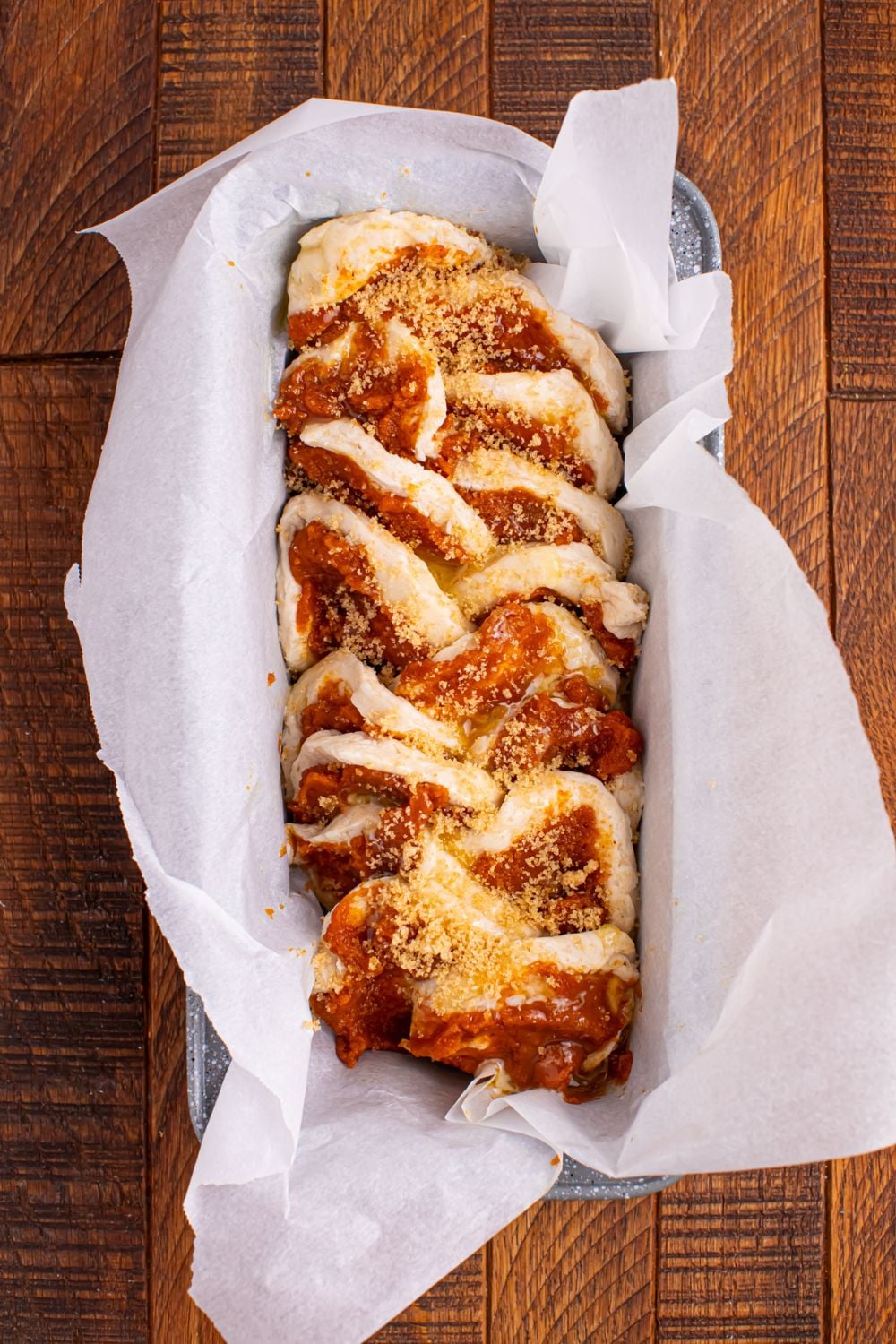 Pumpkin Pie Pull Apart Bread in pan with the crumble on top 