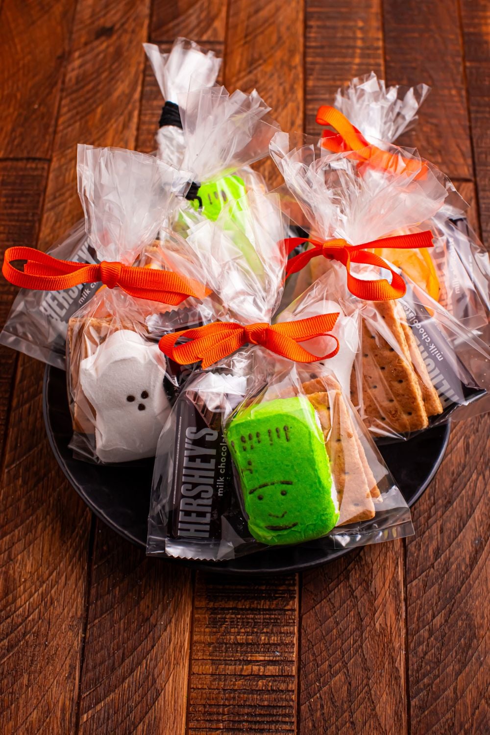 Halloween Smores Gift Bags on a black plate on table 