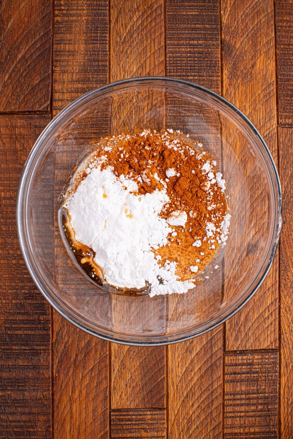 bowl of powdered sugar glaze ingredients on table 