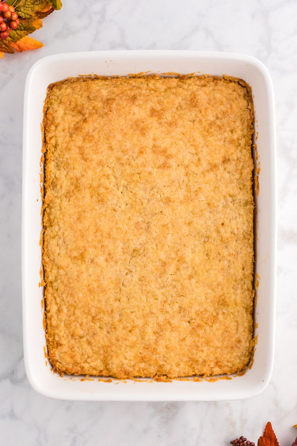 overhead look of Pumpkin Pie Cake in a pan on table 