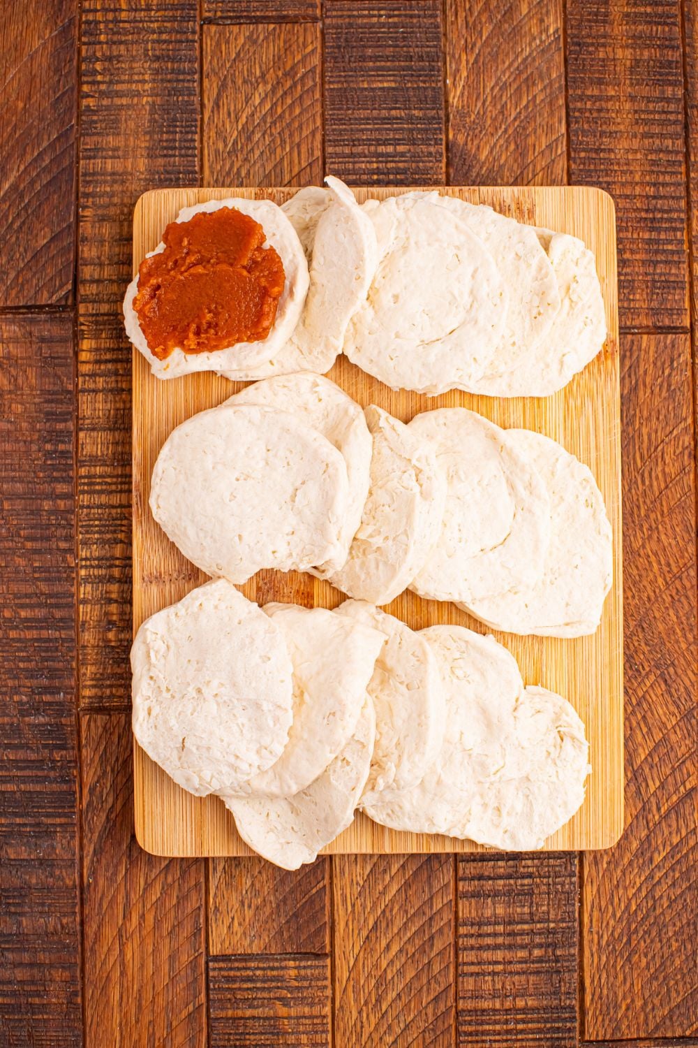 biscuits pulled apart and a bit of pumpkin puree spread on one of the biscuit 
