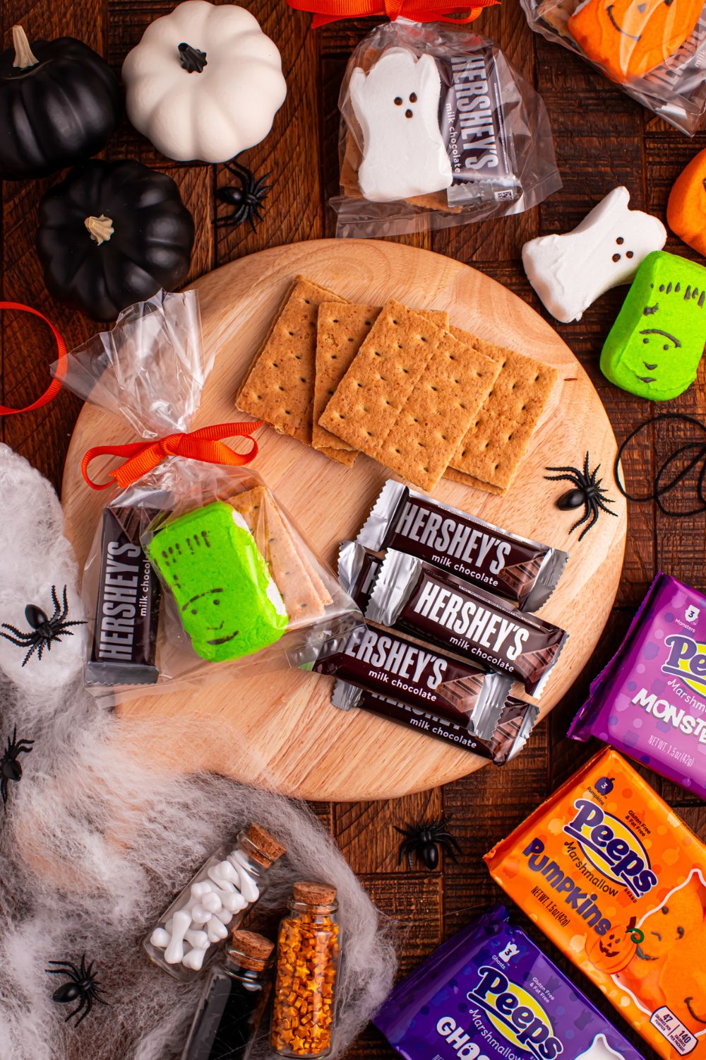 Halloween Smores Gift Bag on table with chocolate bars and graham crackers to the side 