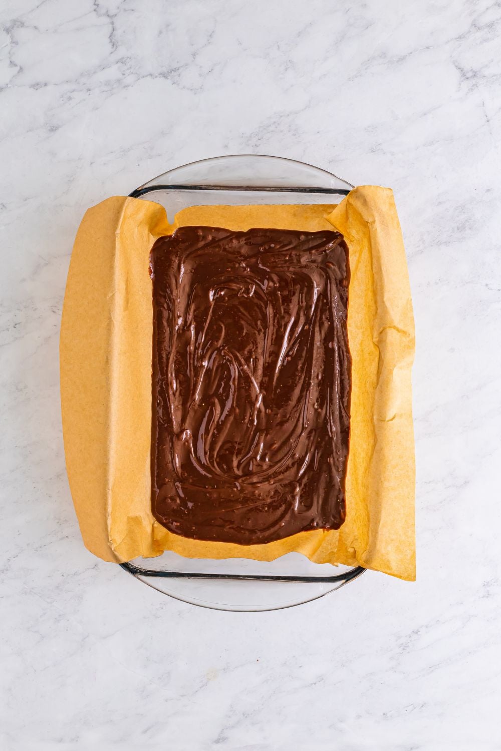 overhead look of baking dish with brownie mix in it