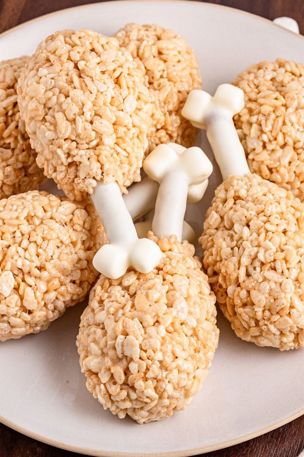 Rice Krispie Treat Turkey Legs stacked on a platter overlapping one another