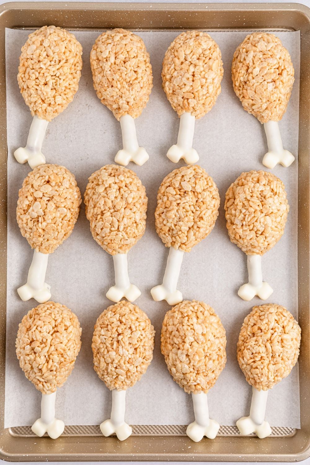 overhead look of Rice Krispie Treat Turkey Legs on a baking tray spread out