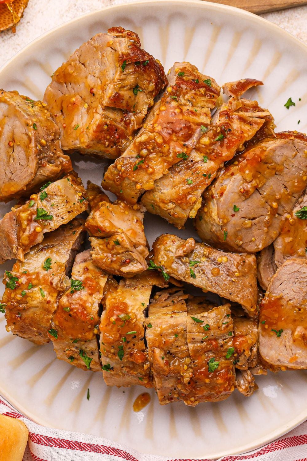 Apricot Pork Tenderloin sliced and placed on a platter on table