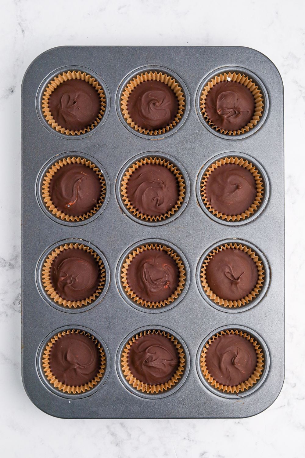 Peanut Butter Marshmallow Cups in muffin tin on table
