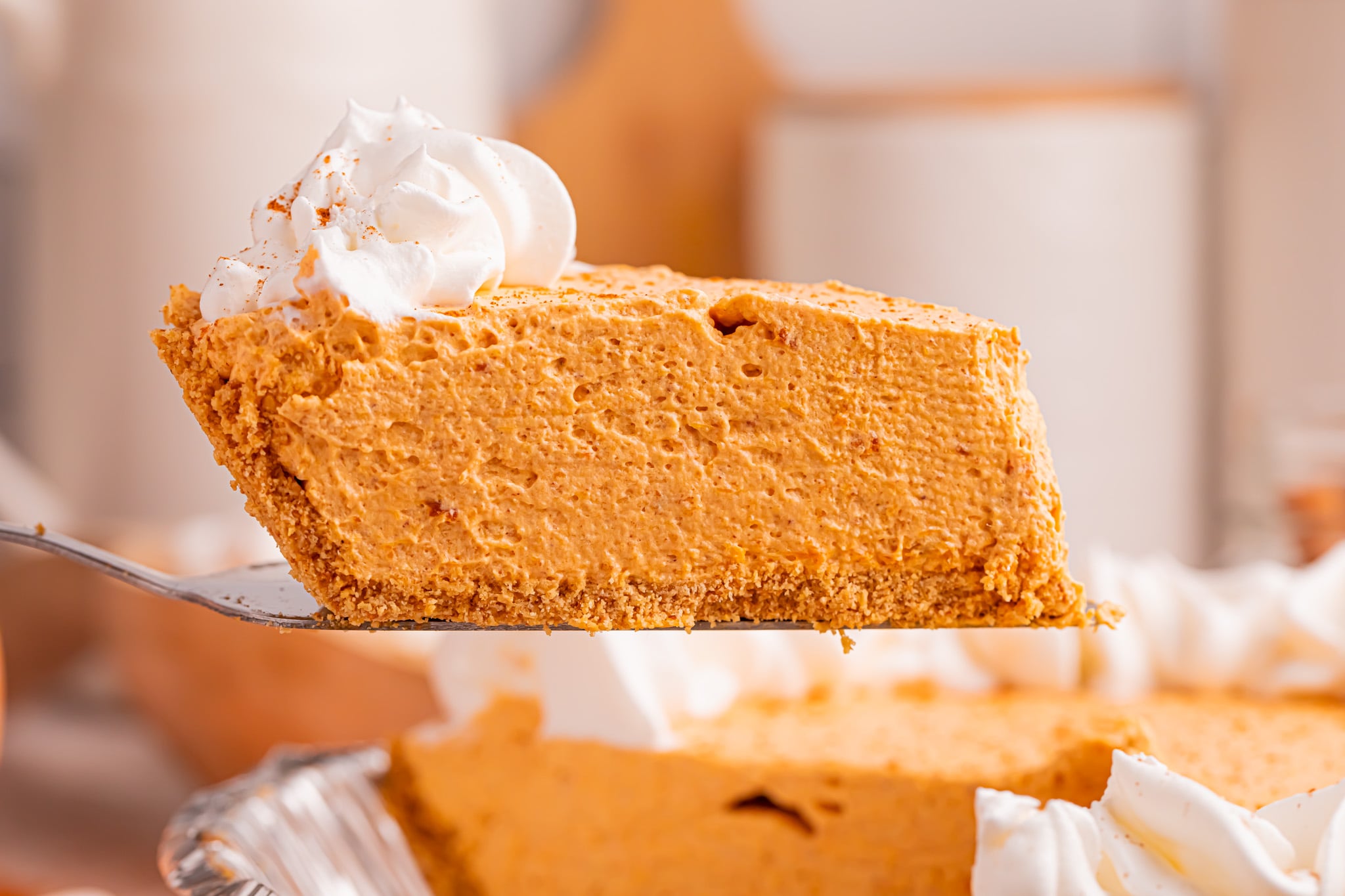 Marshmallow Pumpkin Pie slice being lifted up