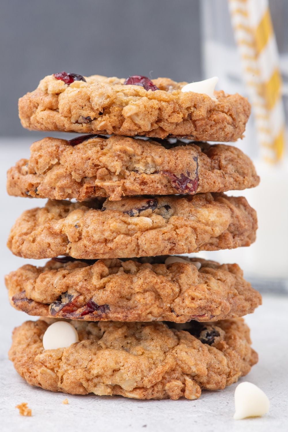 White Chocolate Cranberry Oatmeal Cookies stacked on table